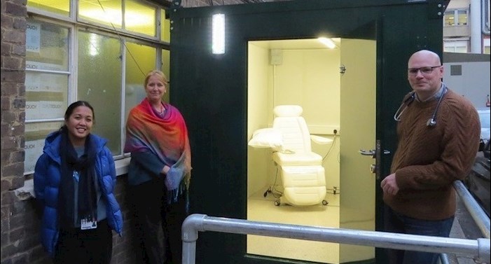 King's College Hospital Staff stand outside the swabbing pod
