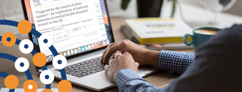 A person reading a paper online