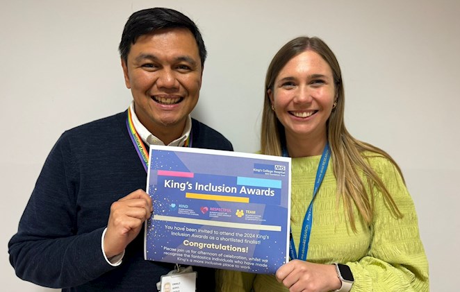Dani and Cat from the King's CRF holding up their King's Inclusion Awards shortlisting letter