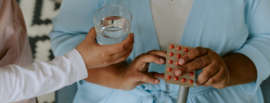 Mature Patient Taking Medicine stock photo