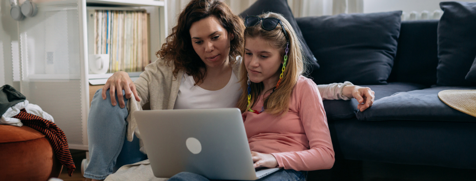 Mother and daughter at home stock photo girl on laptop